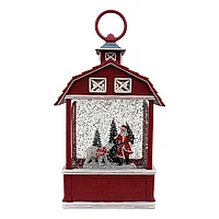 Decoratiune pentru Craciun reprezentand o casa din plastic cu figurine de Craciun, cu muzica, apa si lumina,